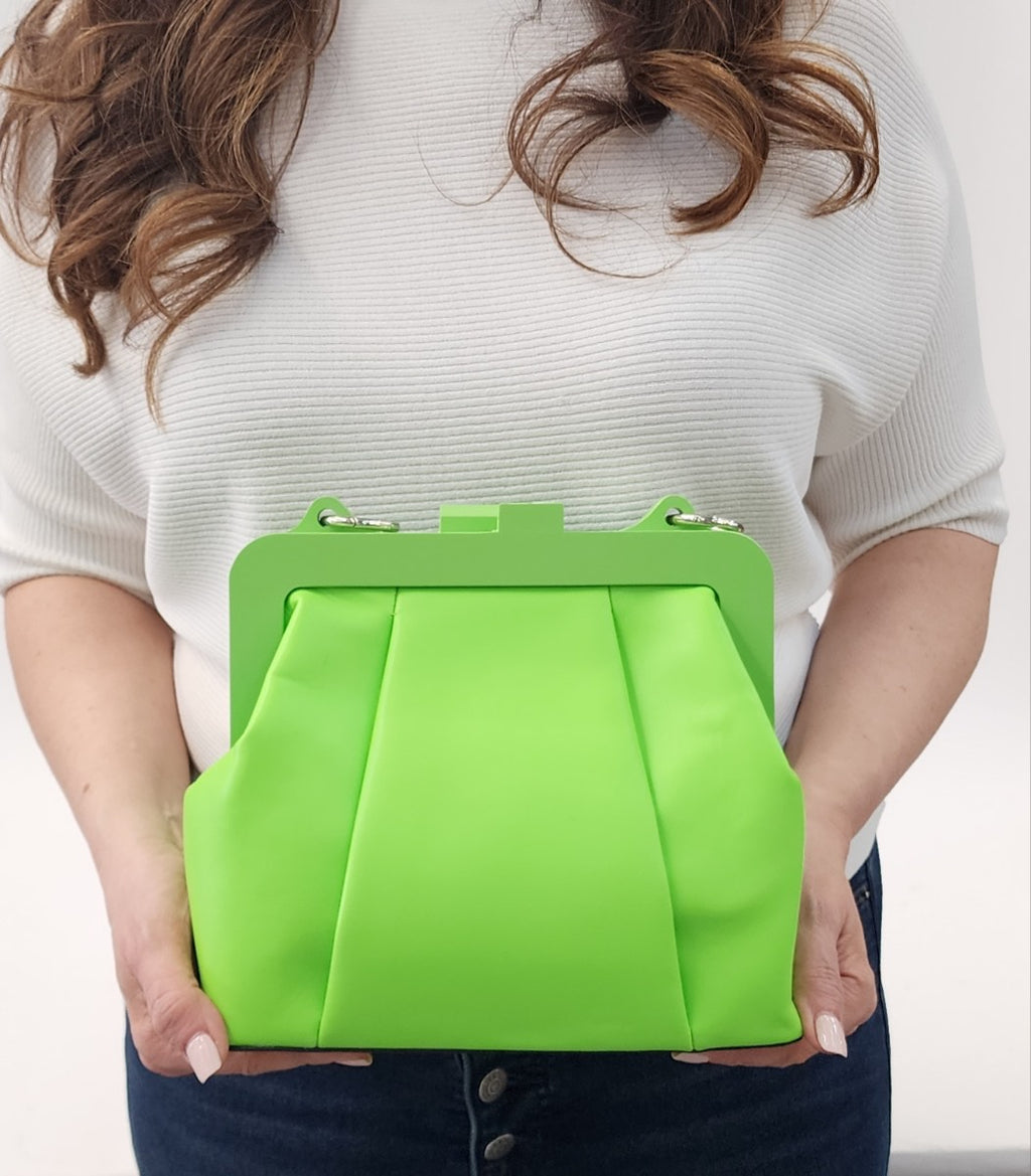 This handbag, with its minimalist modern design, shines with all your creative wardrobe choices. Have fun!